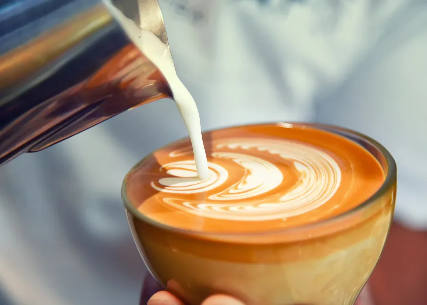 Latte art being poured